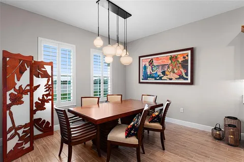 a kitchen with granite countertop a sink appliances cabinets and furniture