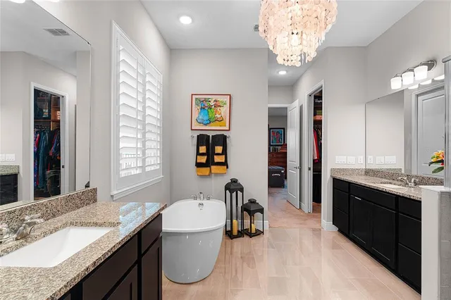 a kitchen with a sink appliances and cabinets