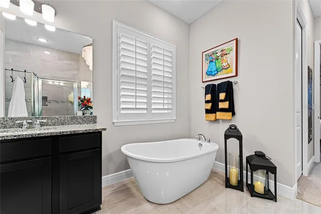 a bathroom with a glass shower door