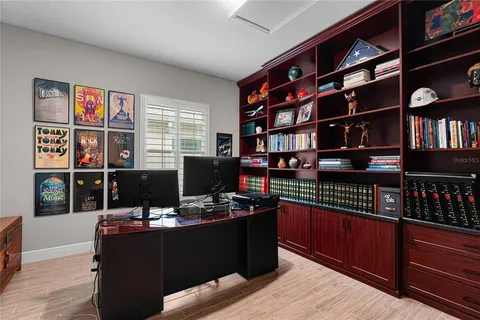 a bedroom with furniture and a window