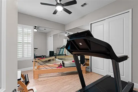 a bathroom with a sink vanity and a mirror