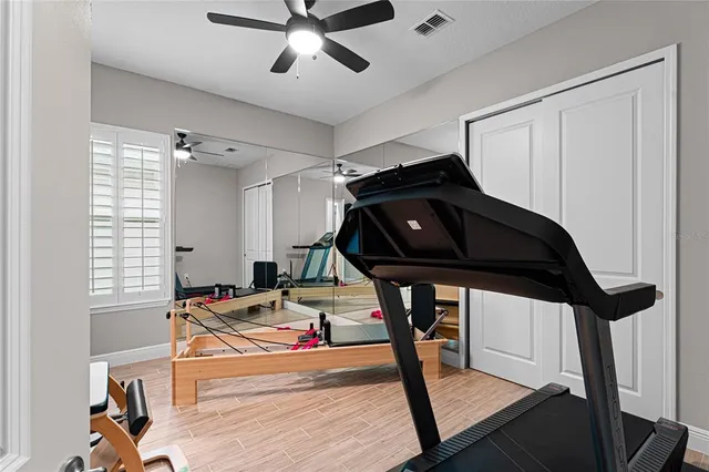 a bathroom with a sink vanity and a mirror