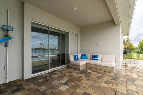 a view of outdoor space with swimming pool and barbeque oven