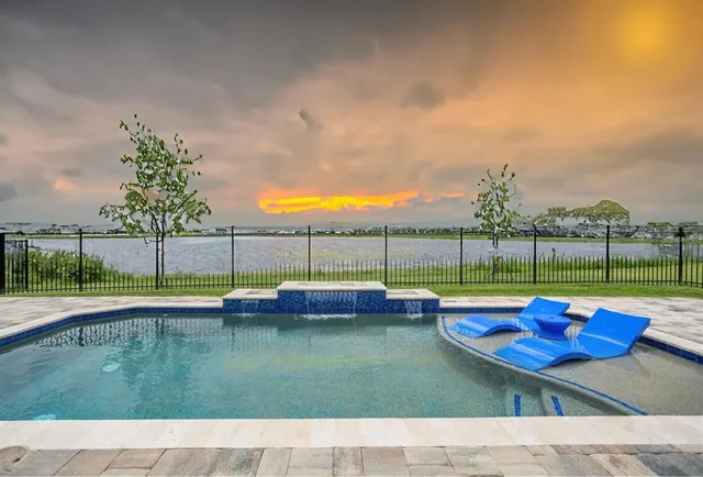 a view of a backyard with sitting area