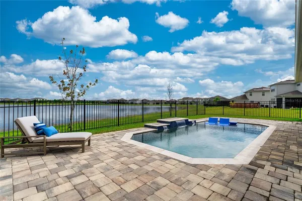 a hallway view with wooden floor and furniture