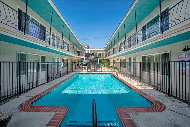 a view of yard with swimming pool outdoor seating