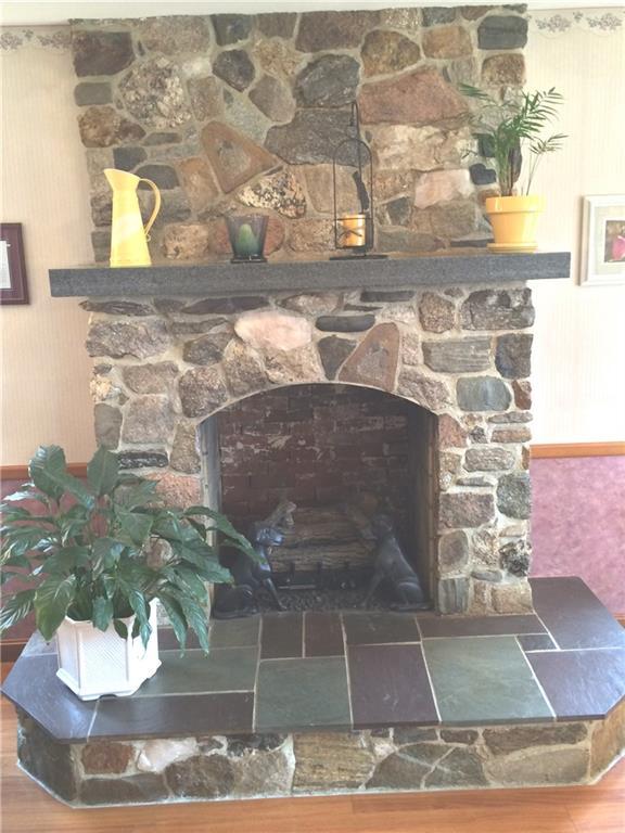 999 Pownal Road Auburn, ME 04210 - Photo 16 of 34 Custom stone fireplace offers a...