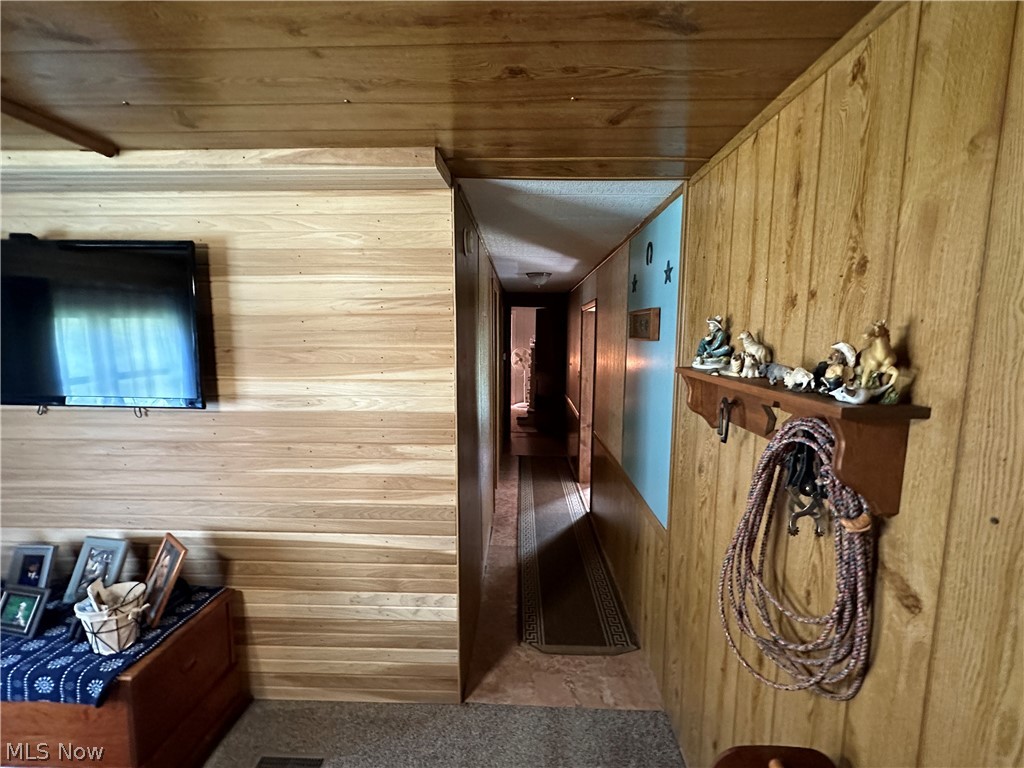 4041 Gray Road Kimbolton, OH 43749 - Photo 9 of 32 Corridor with wooden walls