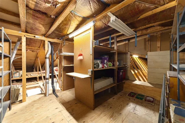 a view of living room with chairs and mirrors