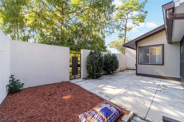 a view of house with backyard