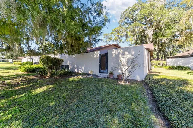 a view of a swimming pool with a garden