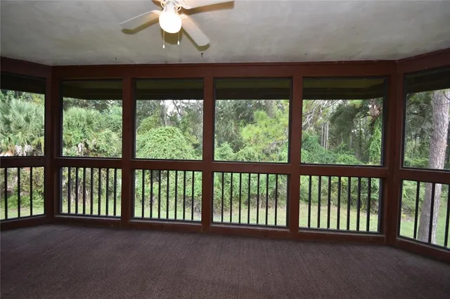 a view of a balcony with a ceiling fan