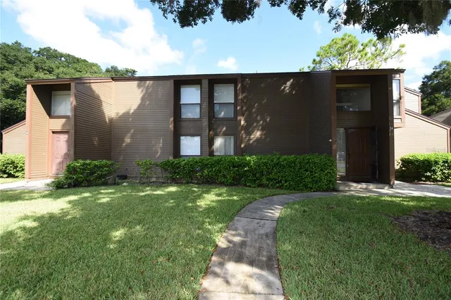 a backyard of a house with lots of green space