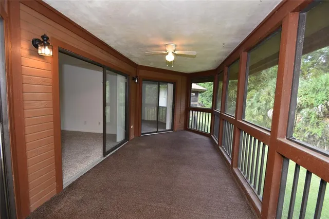 a view of a hallway to rooms