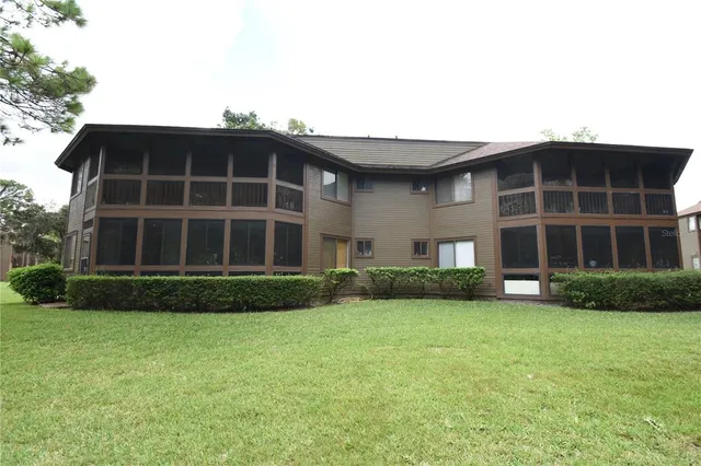 a view of a street with large trees
