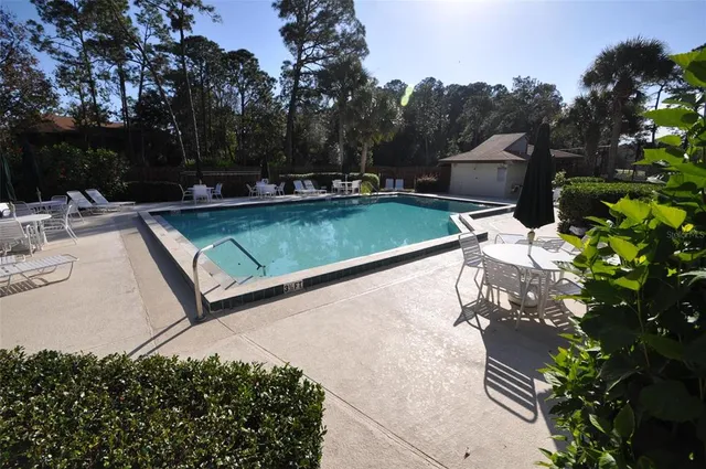 a view of a swimming pool with a patio