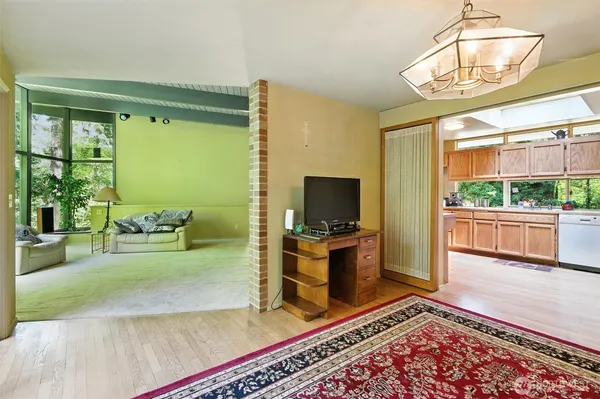 a living room with fireplace furniture and a flat screen tv