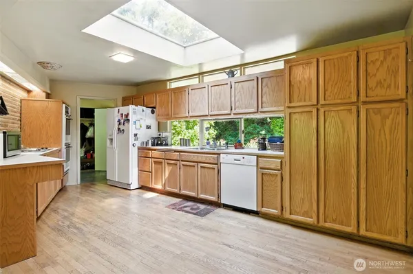 a view of a house with backyard and deck