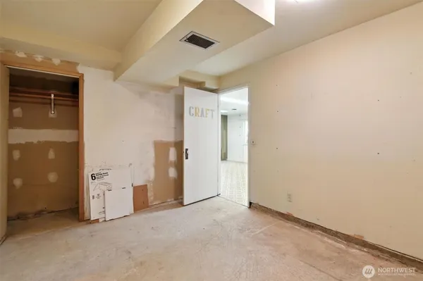 a bathroom with a toilet and a mirror