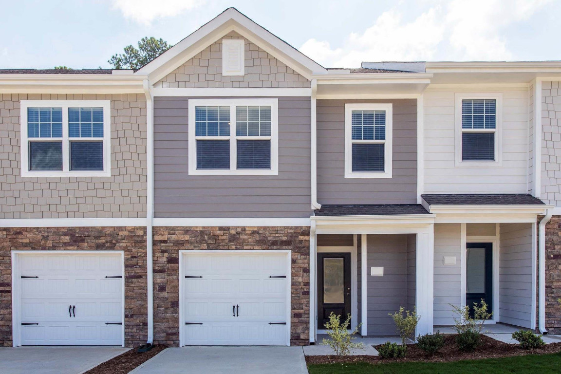 6932 Outfall Point Lane Raleigh, NC 27616 - Photo 1 of 14 a front view of a house