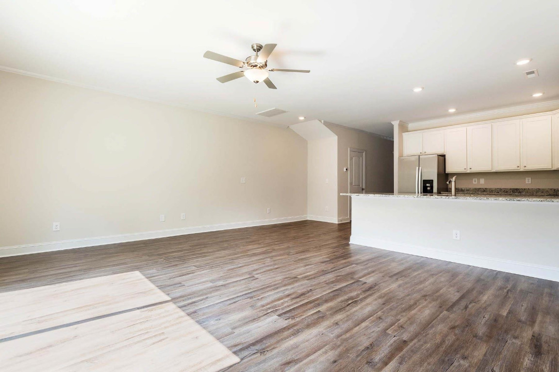 6932 Outfall Point Lane Raleigh, NC 27616 - Photo 9 of 14 a view of a kitchen with a sink and a refrigerator