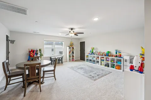 a bedroom with furniture and a chandelier