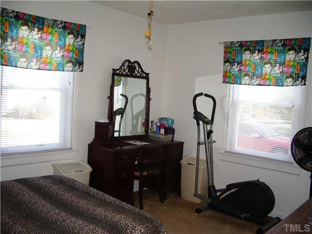 2224 Sheffield Road Raleigh, NC 27610 - Photo 9 of 18 a living room with furniture and a window