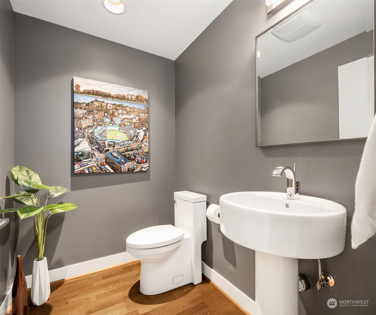 315 West Galer Street, Unit 101 Seattle, WA 98119 - Photo 12 of 37 a bathroom with a toilet sink and mirror