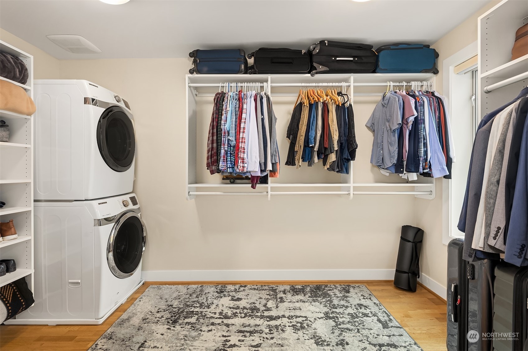 315 West Galer Street, Unit 101 Seattle, WA 98119 - Photo 16 of 37 a view of walk in closet with clothes and shoes