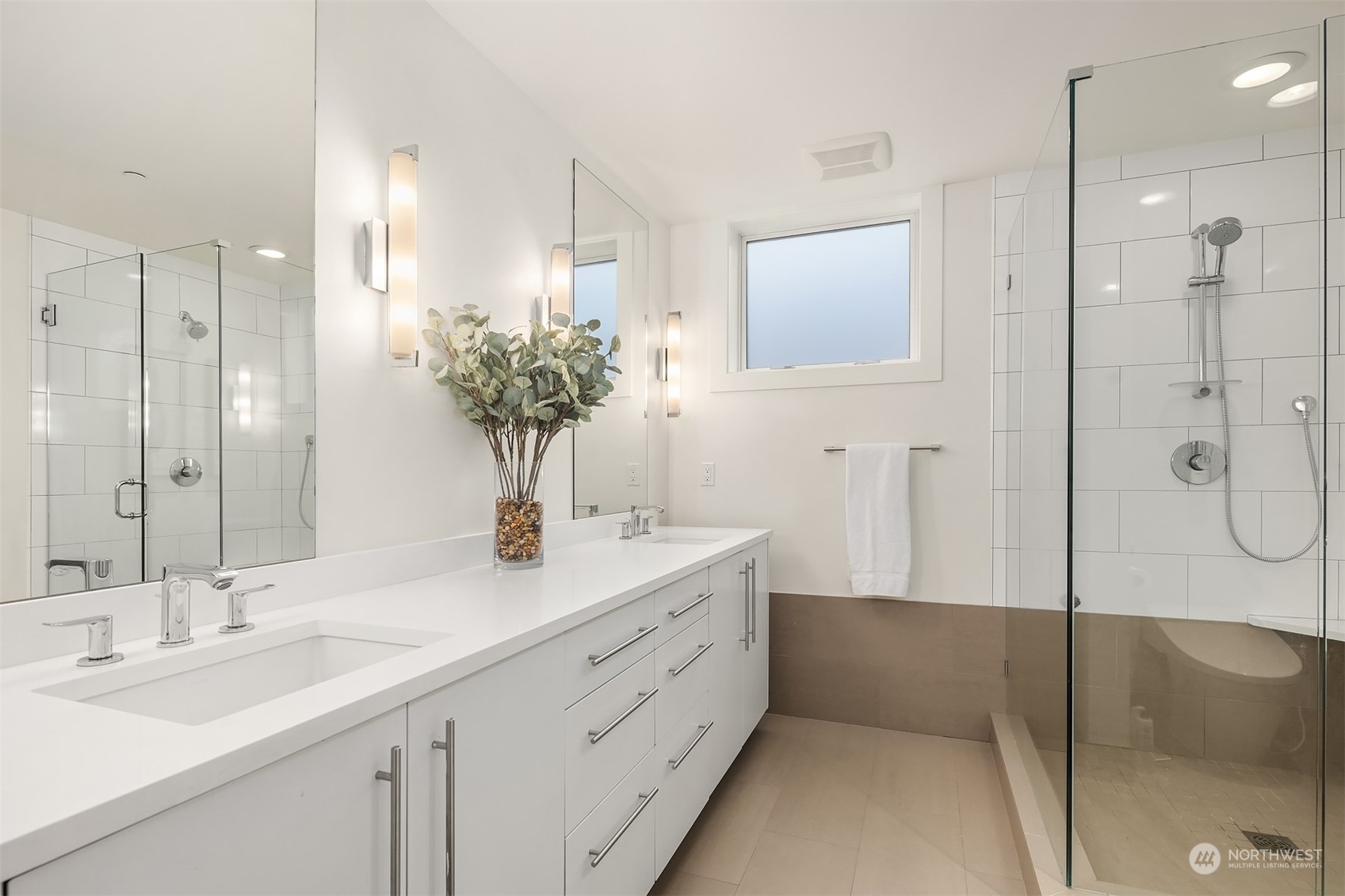 315 West Galer Street, Unit 101 Seattle, WA 98119 - Photo 17 of 37 a bathroom with a double vanity sink mirror and shower