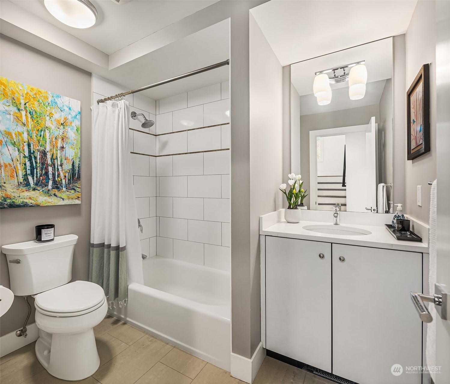 315 West Galer Street, Unit 101 Seattle, WA 98119 - Photo 18 of 37 a bathroom with a bathtub shower sink vanity and toilet