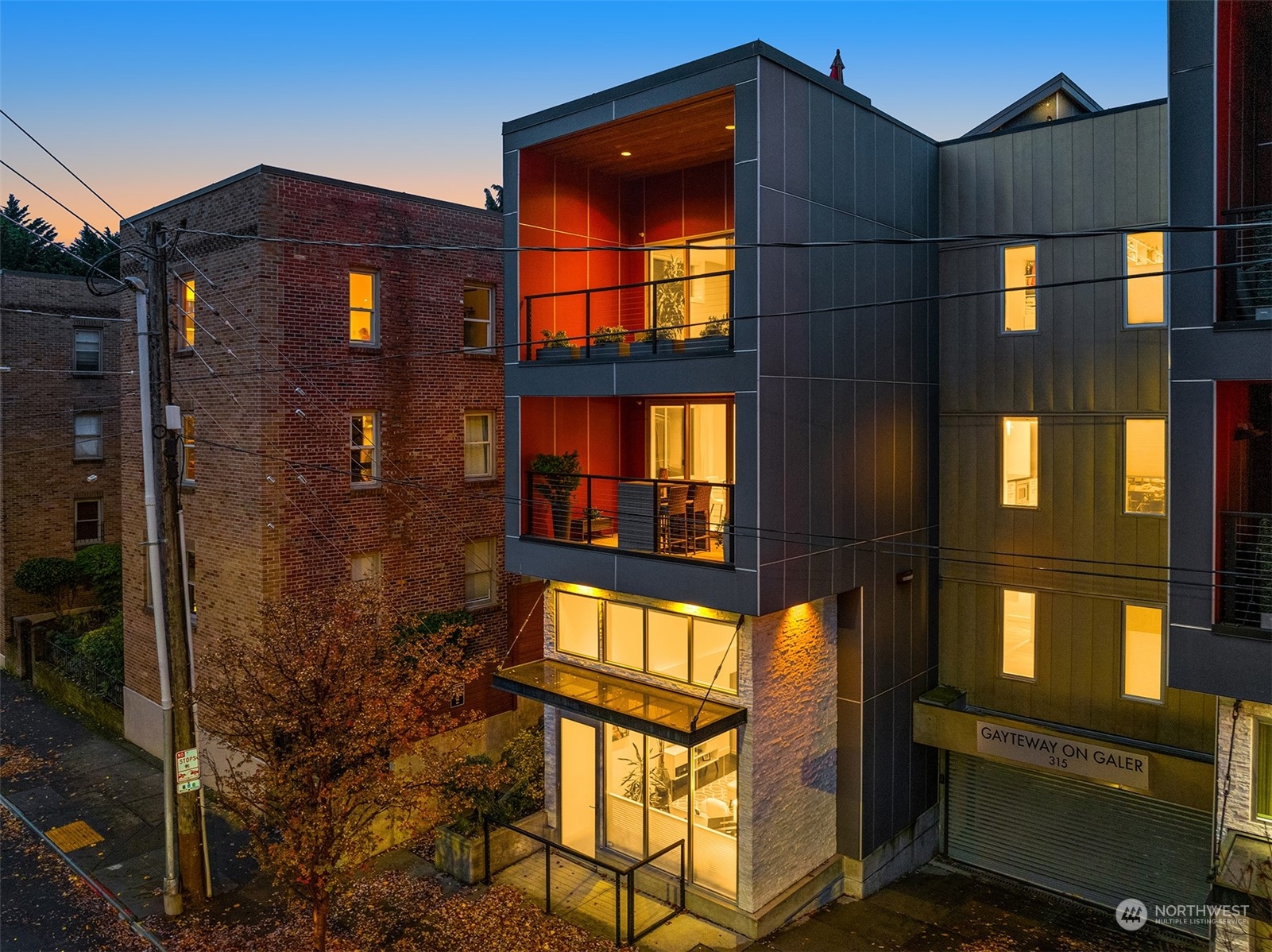 315 West Galer Street, Unit 101 Seattle, WA 98119 - Photo 33 of 37 a front view of a building with a glass door