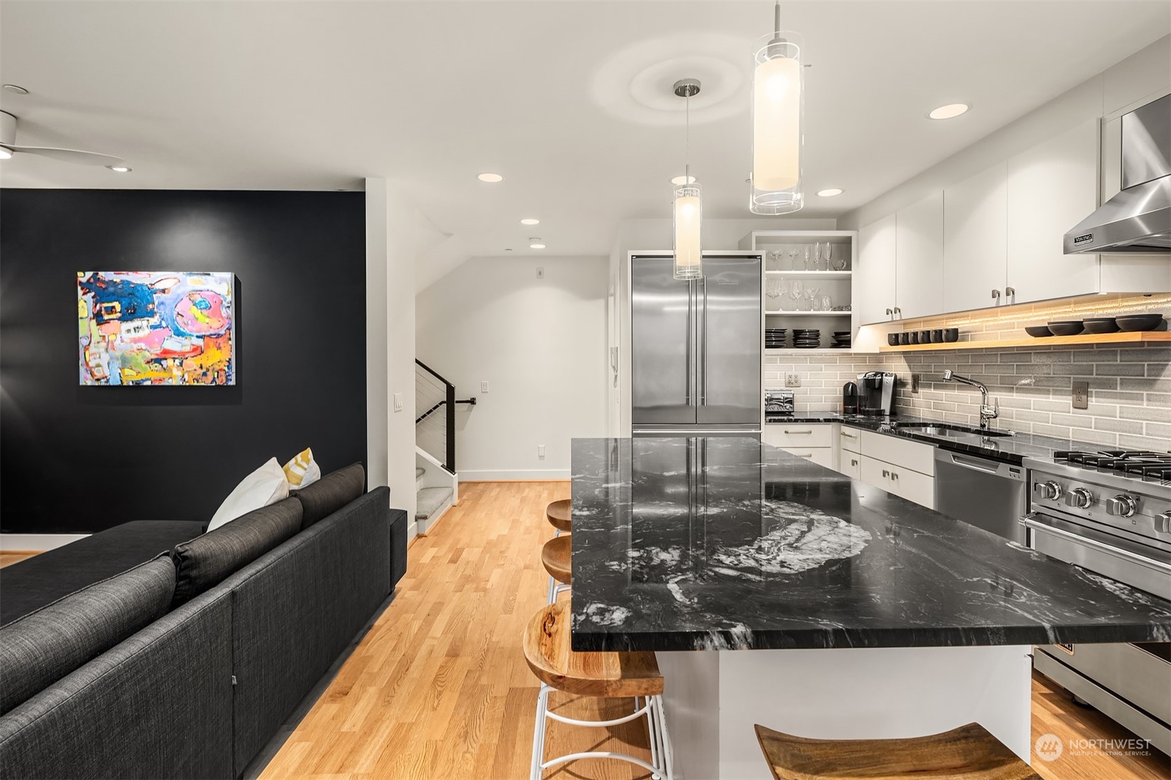 315 West Galer Street, Unit 101 Seattle, WA 98119 - Photo 8 of 37 a kitchen with kitchen island stainless steel appliances a sink and cabinets