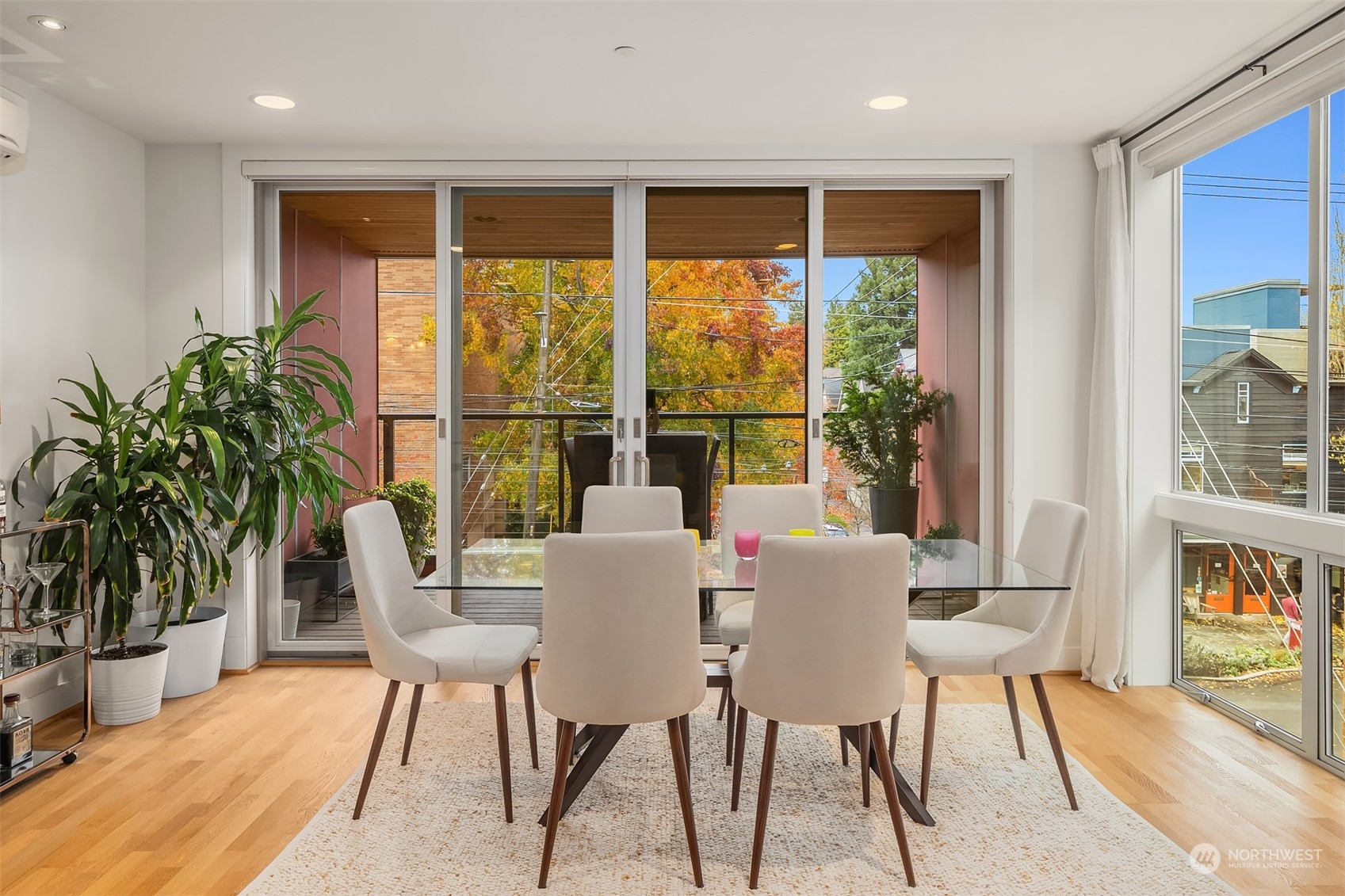 315 West Galer Street, Unit 101 Seattle, WA 98119 - Photo 10 of 37 a view of a dining room with furniture window and wooden floor
