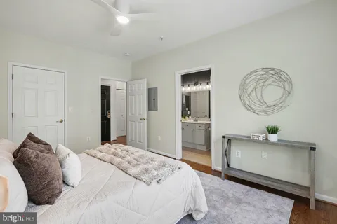 a bedroom with a bed and cabinets