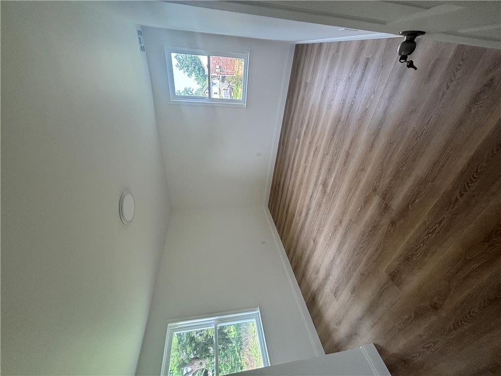 848 Hausman Road Allentown, PA 18104 - Photo 9 of 11 Naturally illuminated interiors boast gleaming wood-look flooring and tall windows.