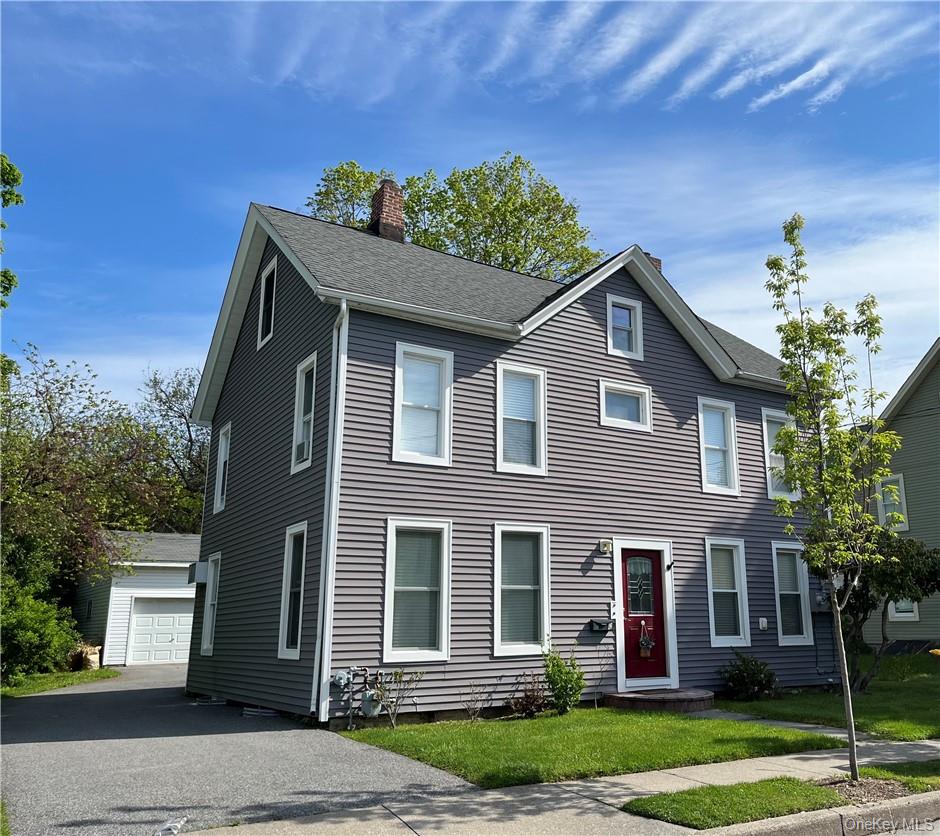 a front view of a house with a yard