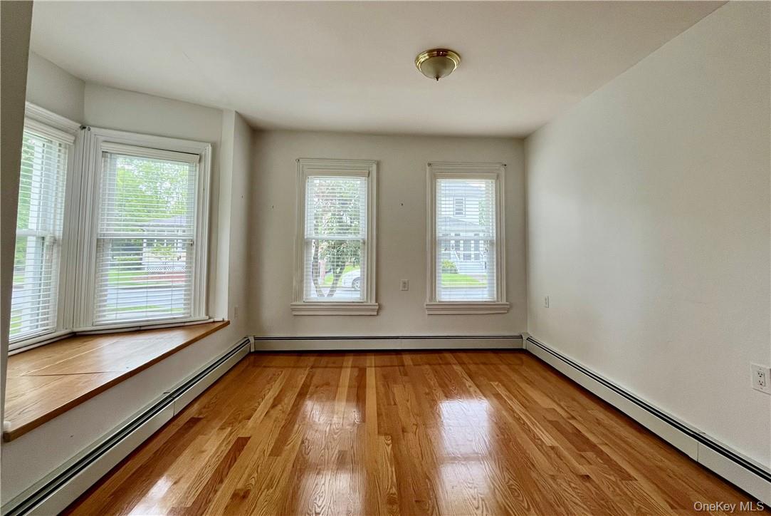 6 Cottage Street, Unit 2 Warwick, NY 10990 - Photo 3 of 12 a view of empty room with wooden floor and fan