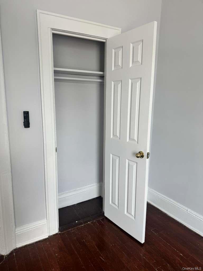 88-54 75th Street Queens, NY 11421 - Photo 11 of 14 a view of front door with wooden floor