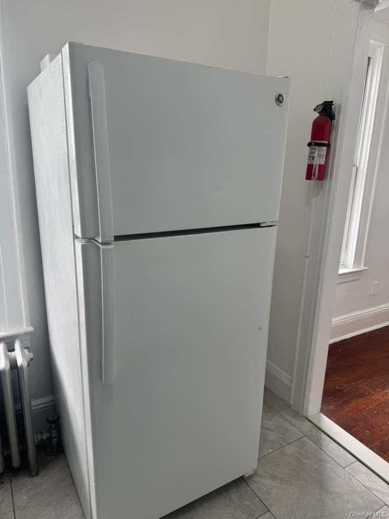 88-54 75th Street Queens, NY 11421 - Photo 6 of 14 a white refrigerator freezer and a refrigerator in a kitchen
