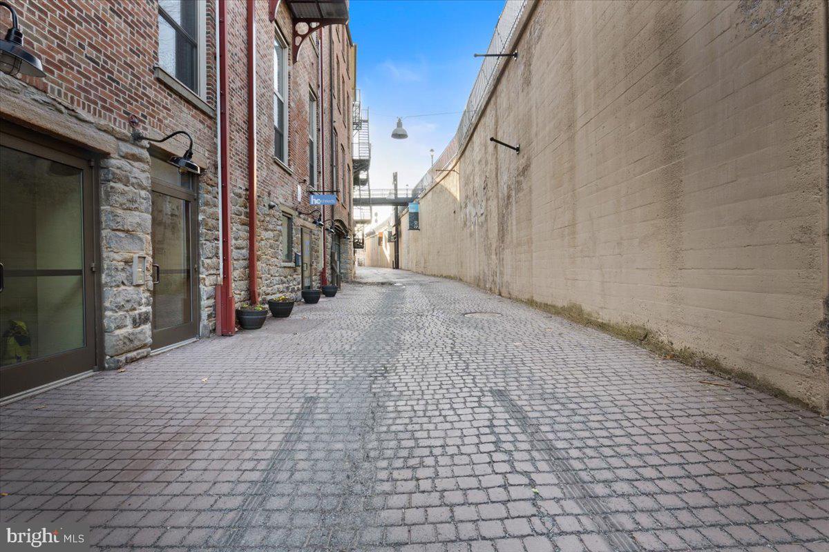 509 Bogart Place, Unit 202 Scranton, PA 18505 - Photo 28 of 43 Charming cobblestone alleyway scene.