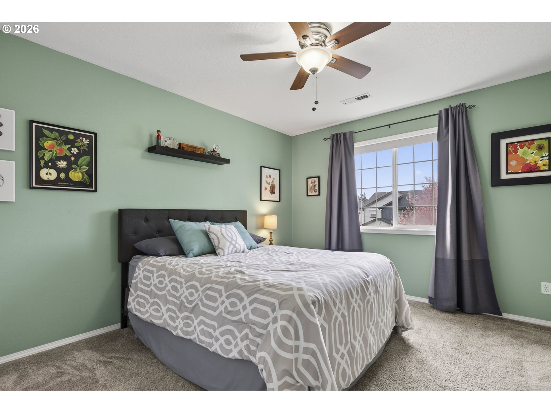 163 Southwest Sandlewood Loop Gresham, OR 97030 - Photo 25 of 47 a bedroom with a large bed and a chandelier