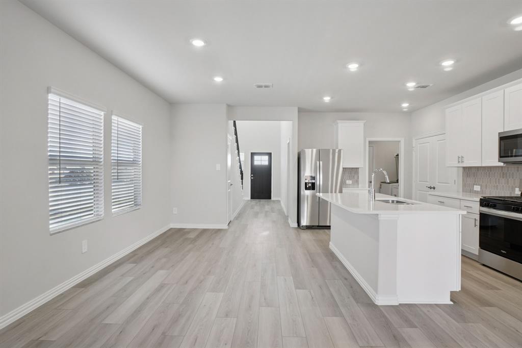 809 River Lane Lavon, TX 75166 - Photo 12 of 39 a view of kitchen with stainless steel appliances refrigerator oven and cabinets