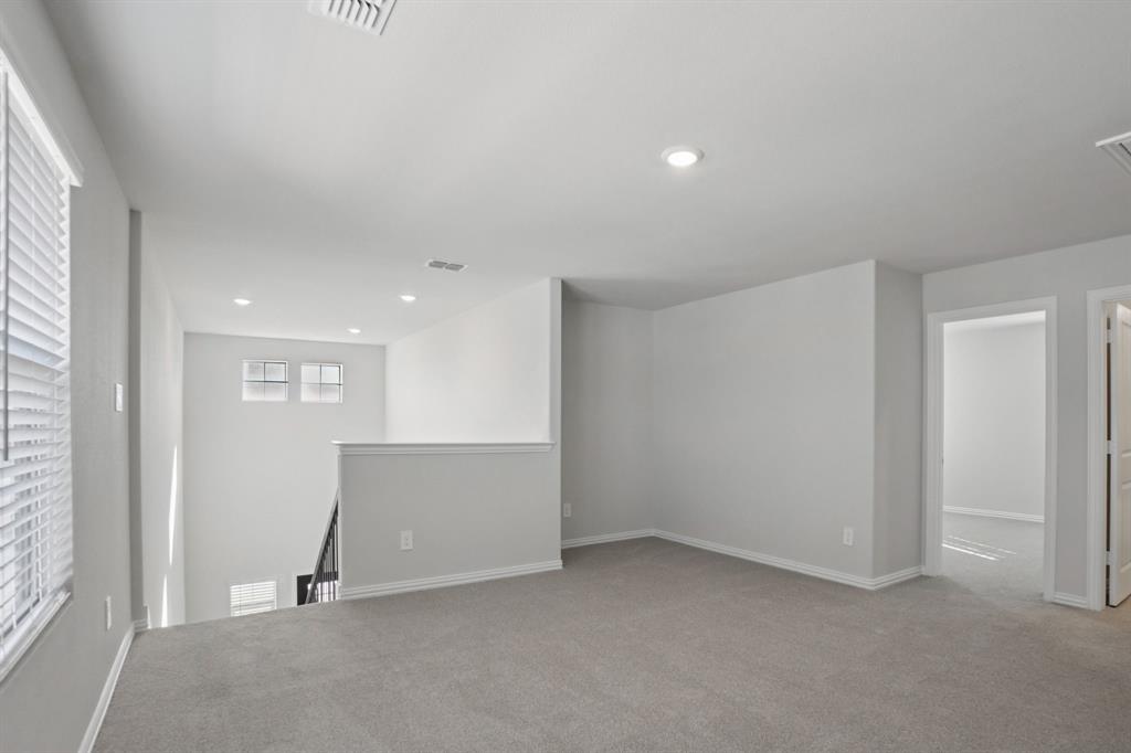 809 River Lane Lavon, TX 75166 - Photo 22 of 39 an empty room with windows