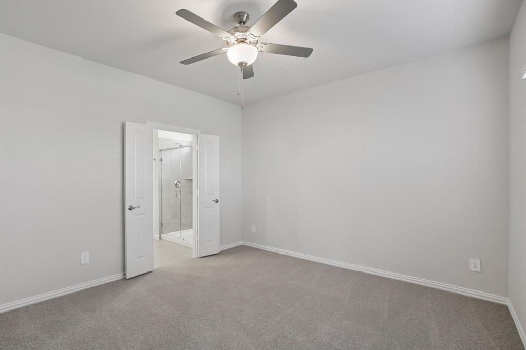 809 River Lane Lavon, TX 75166 - Photo 30 of 39 an empty room with a ceiling fan and a window
