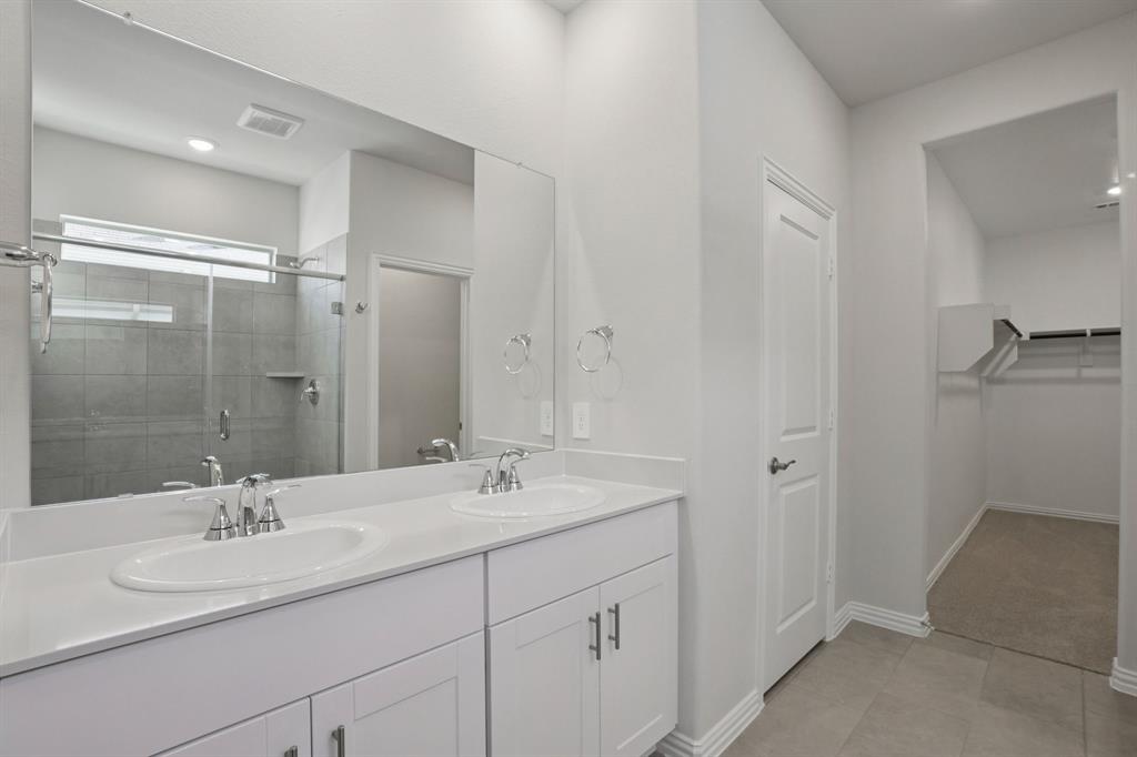 809 River Lane Lavon, TX 75166 - Photo 33 of 39 a bathroom with a double vanity sink mirror and shower