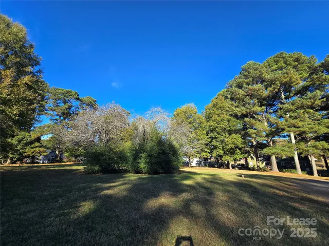 a view of a street with a building in the background