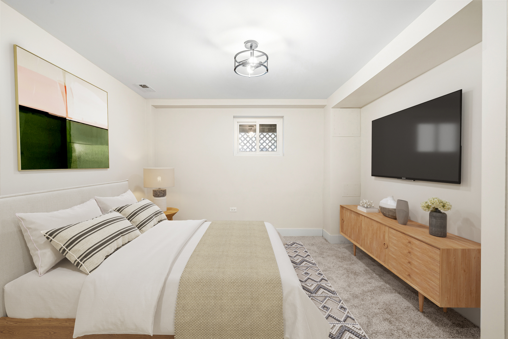 7955 South Colfax Avenue Chicago, IL 60617 - Photo 14 of 24 a bedroom with a bed and a flat screen tv