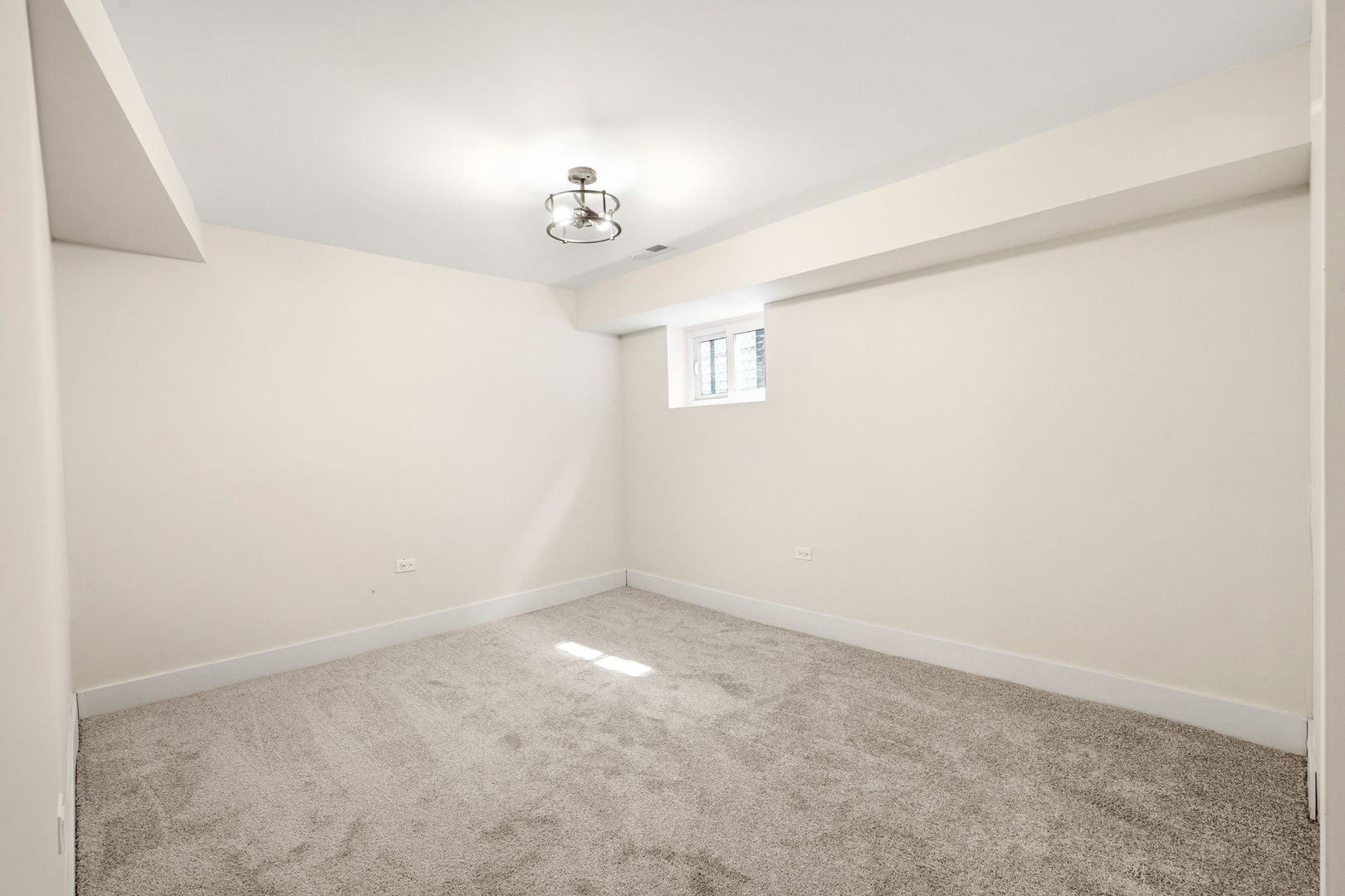 7955 South Colfax Avenue Chicago, IL 60617 - Photo 18 of 24 an empty room with a chandelier fan