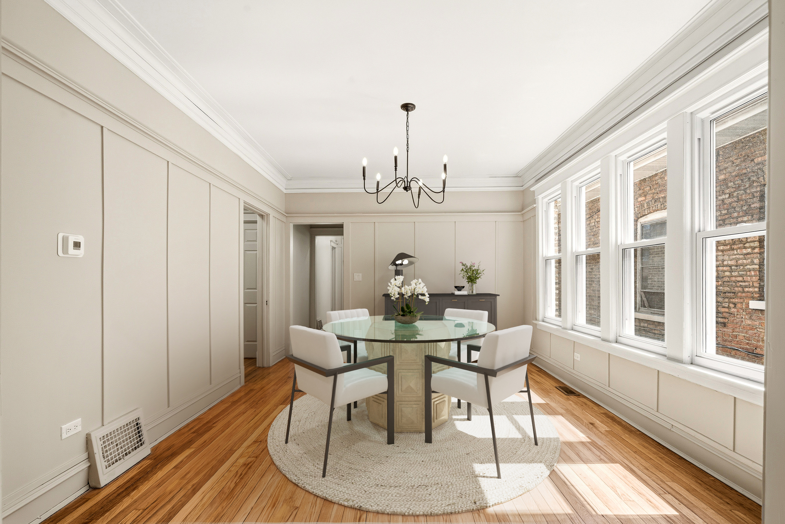 7955 South Colfax Avenue Chicago, IL 60617 - Photo 5 of 24 a view of a dining room with furniture window and wooden floor